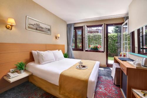 a hotel room with a bed and a sink at Almina Hotel - Special Class in Istanbul