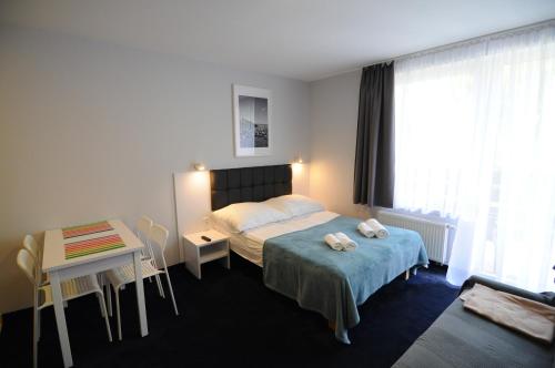 Postel nebo postele na pokoji v ubytování Pensjonat Magnolie