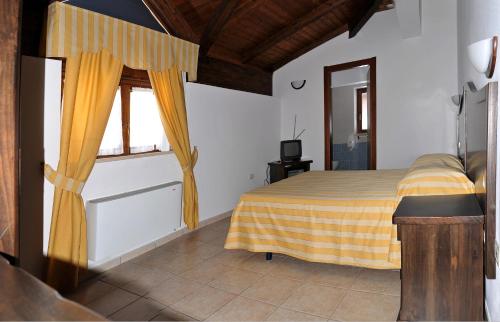 Postel nebo postele na pokoji v ubytování Hotel Pietrapanna