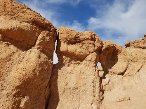 a rock wall with the sky in the background at Nkhila Lodge in Marrakech