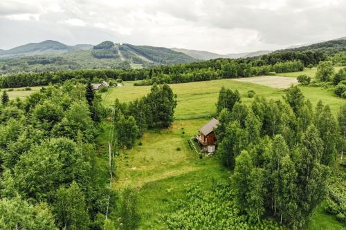 an aerial view of a farm with a house in a field at Shanti House in Migovo