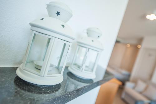 two candles sitting on a counter in a room at Studio met groot zonneterras centrum Oostende in Ostend