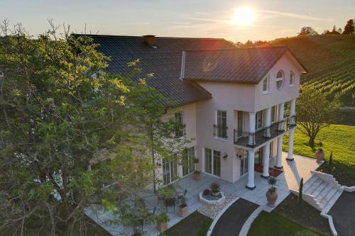 an overhead view of a white house with a sunset at Residenz Styrian Toskana Splendid in Bad Gleichenberg