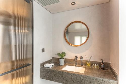 a bathroom with a sink and a mirror at 北京重构空间酒店天安门王府井店 in Beijing