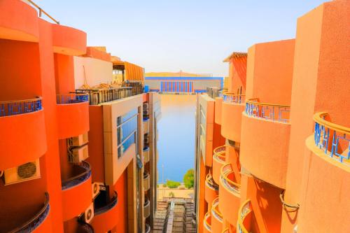 a view of a street between some orange buildings at Citymax Hotel Aswan in Aswan
