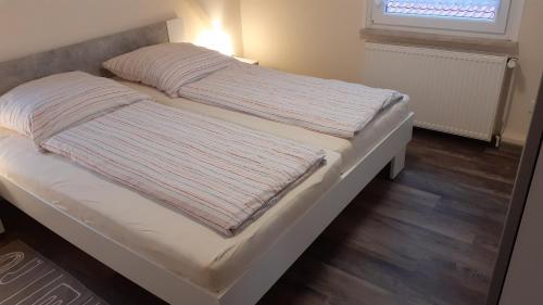 מיטה או מיטות בחדר ב-Eldorado für Fahrradfahrer in Ostfriesland für 2 Personen