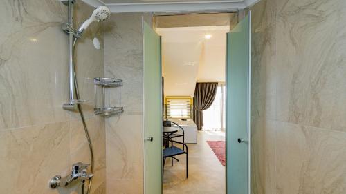 a bathroom with a shower with a glass door at Söğüt 3 - 4 Bedroom with jacuzzi in Fethiye in Fethiye