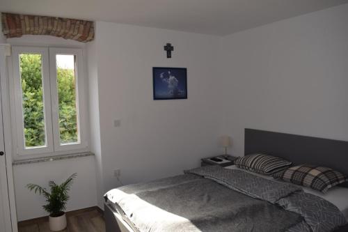 Postel nebo postele na pokoji v ubytování APARTMENTS SCIRENICA