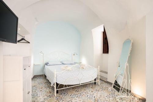 Un pat sau paturi într-o cameră la La Finestrella
