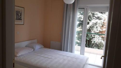 Posteľ alebo postele v izbe v ubytovaní Themis Apartment