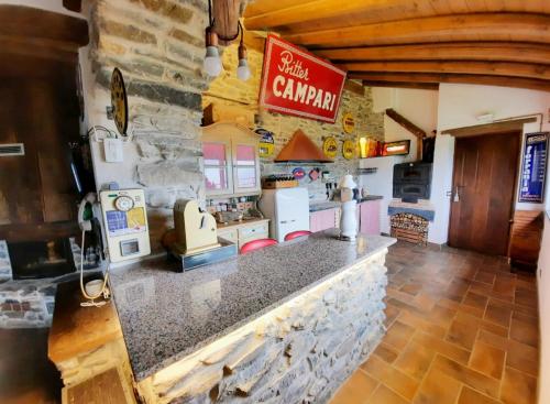 a kitchen with a counter with a pretend kitchen at IL SANTO GRAAL in Triora