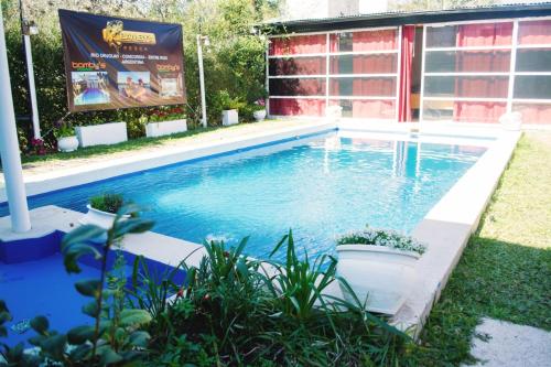 a swimming pool in the backyard of a house at Posada Bambys in Concordia