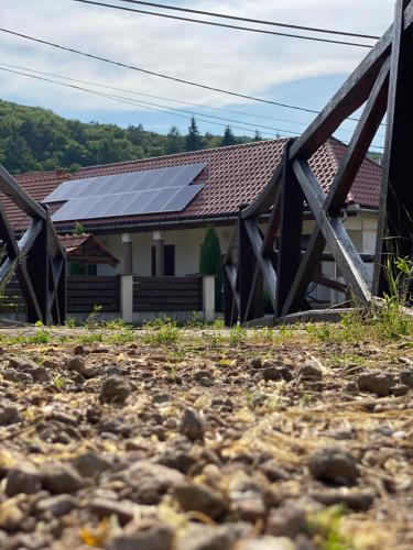 a house with solar panels on the roof at Nagymama Vendégháza in Telkibánya