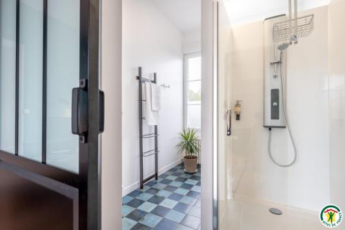 a bathroom with a shower and a toilet at Chez Hortense in Beauvais