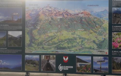 a sign with a map of a park at Ferienwohnung Gstreinthaler in Tulfes