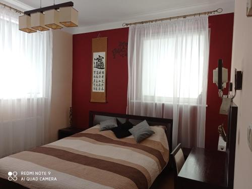 מיטה או מיטות בחדר ב-Apartament Wanessa