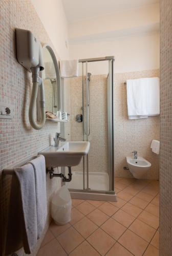 a bathroom with a shower and a sink at Hotel Belvedere in Porto SantʼElpidio
