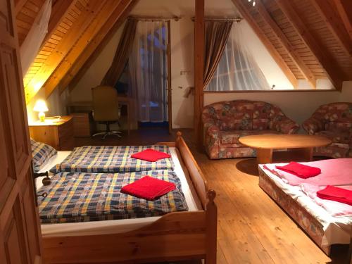 Giường trong phòng chung tại Rózsa Porta