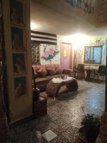 a living room with a couch and a table at Dana Gate Lodge in Dana