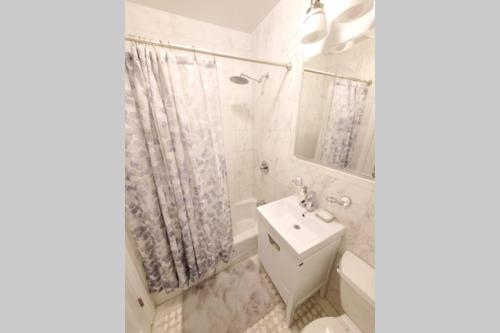 
A bathroom at King size bed Cozy 2 bdrm @ Time Sq/Hells Kitchen
