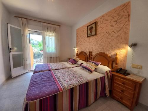 Ένα ή περισσότερα κρεβάτια σε δωμάτιο στο Hotel Rural El Molino