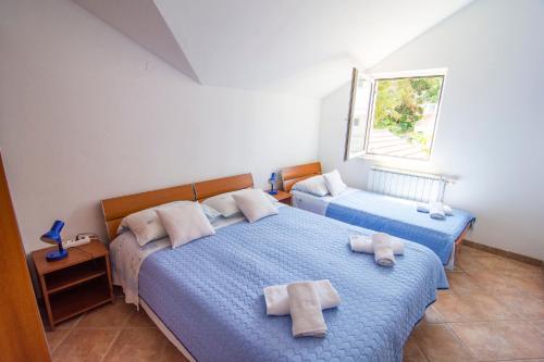 Säng eller sängar i ett rum på Villa Tereza