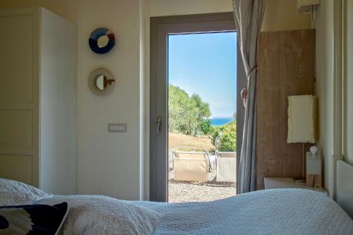 Posteľ alebo postele v izbe v ubytovaní Borgo Lianti case vacanza Sardegna