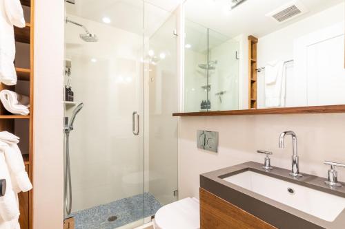 a bathroom with a shower and a sink at Modern Hotel-Style Studio - Timber Creek Lodge #210 Hotel Room in Truckee
