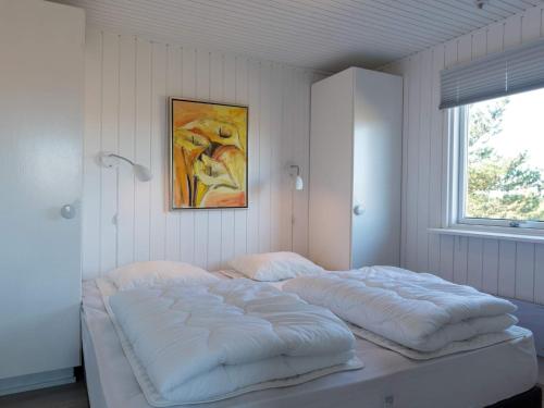 Postel nebo postele na pokoji v ubytování Holiday home Fanø C