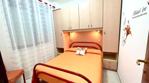 a hospital room with a bed and cabinets at Belvedere Home in Rodi Garganico