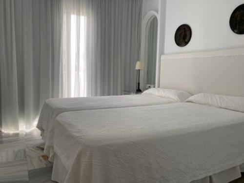Postel nebo postele na pokoji v ubytování Hotel Suites Albayzin Del Mar