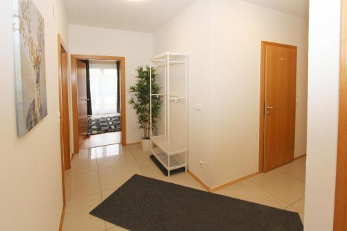 a room with a hallway with a closet and a door at Steira-Studios Leibnitz in Leibnitz