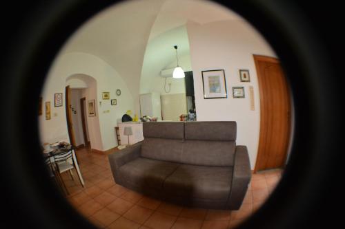 a living room with a couch and a table at Casa Romeo in Adrano