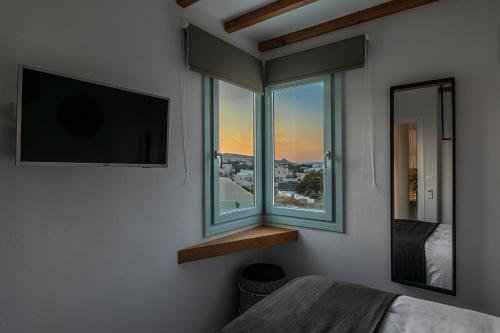Letto o letti in una camera di Santo Bloom Luxury Villas