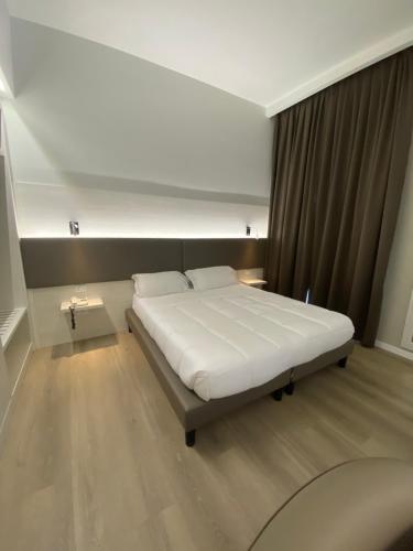 Postel nebo postele na pokoji v ubytování Hotel Parco Delle Rose