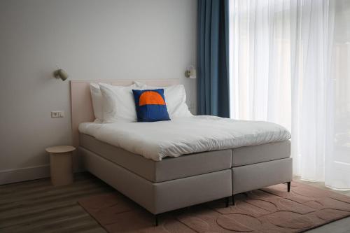 a bed in a room with at Hotel Bries Den Haag - Scheveningen in The Hague