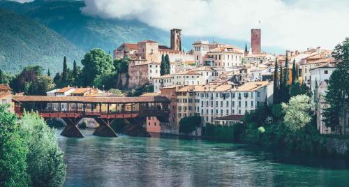 a bridge over a river in front of a city at Casa Ronzani B&B in Salcedo