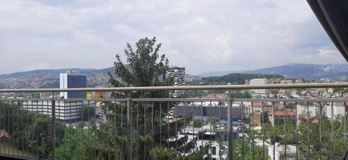 a view of a city from a balcony at Beautiful View Of Sarajevo Center in Sarajevo