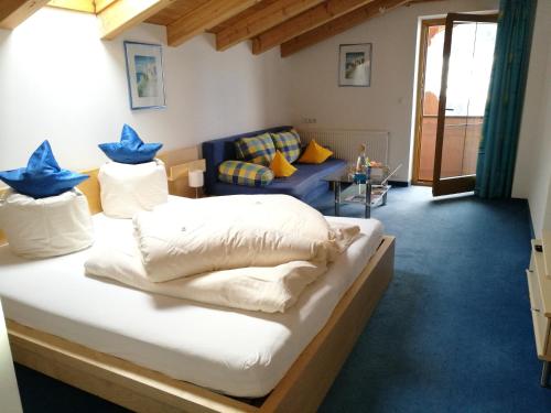 a room with a bed with blue stars on it at Haus Kristall in Alpbach