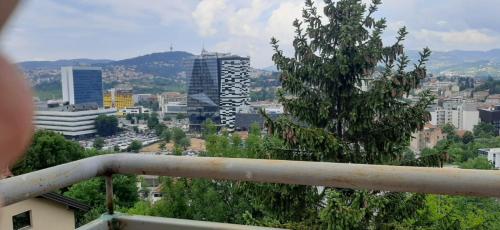 a view of a city from a balcony at Beautiful View Of Sarajevo Center in Sarajevo