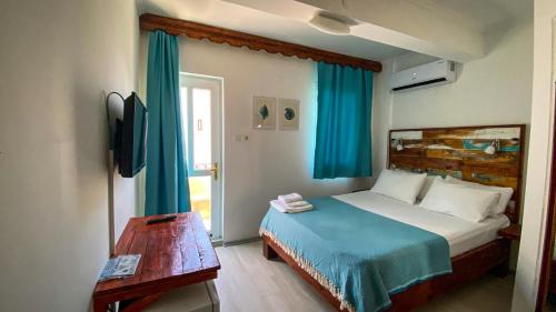 Postel nebo postele na pokoji v ubytování merih butik hotel