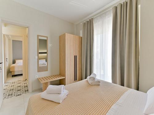 Posteľ alebo postele v izbe v ubytovaní KaSta Family Apartments