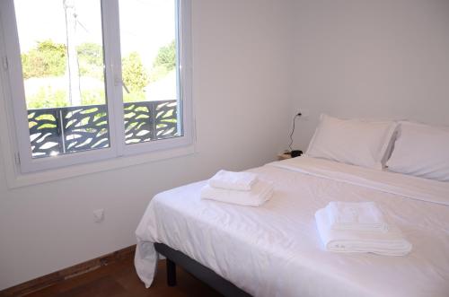 מיטה או מיטות בחדר ב-CapriBeach