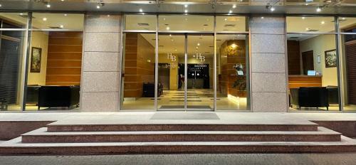 a lobby of a building with a revolving door at Premium Hotel Bacero Wrocław in Wrocław