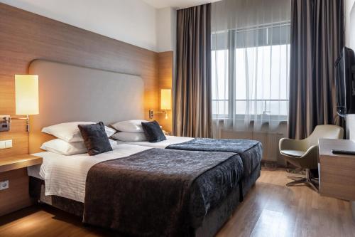 Ramada Encore Kyiv — Bedroom
