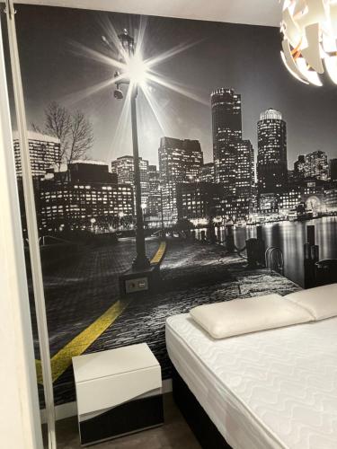 a bedroom with a view of a city skyline at Tunel10 in Zamora