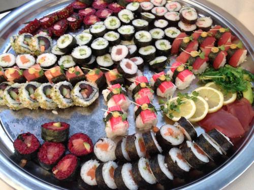 a platter of sushi and other food on a table at Bed & Breakfast De Vier Seizoenen in Lisse