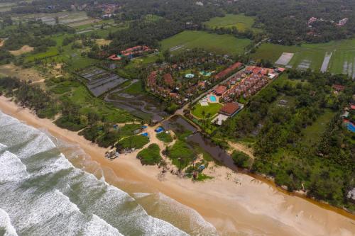 an aerial view of the shoreline of a beach at Nanu Beach Resort & Spa in Betalbatim