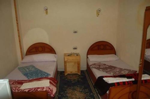Ein Bett oder Betten in einem Zimmer der Unterkunft Kelany Hotel