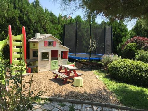 a play area with a play house and a playground at Sea Dream Rental Apartments in Varna City